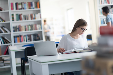 Image showing female student study in school library