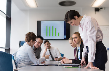 Image showing young  woman using  tablet on business meeting