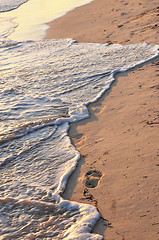 Image showing Tropical beach with footprints