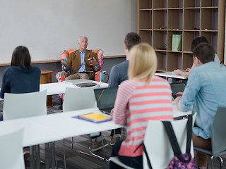 Image showing teacher with a group of students in classroom