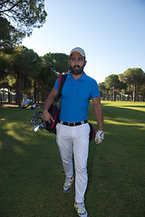 Image showing golf player walking