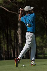 Image showing golf player hitting shot