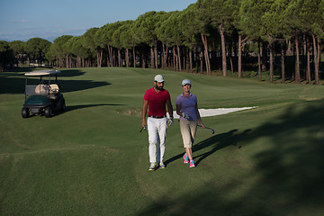 Image showing couple walking on golf course