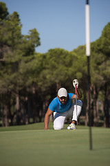 Image showing golf player aiming perfect  shot
