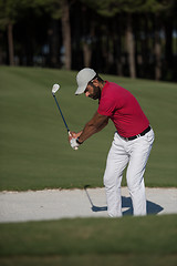 Image showing golfer hitting a sand bunker shot