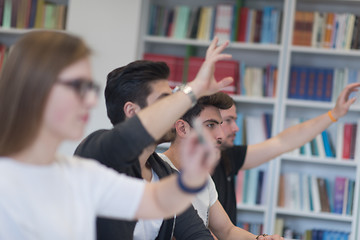 Image showing group of students  raise hands up