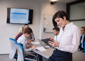 Image showing business woman on meeting  using tablet