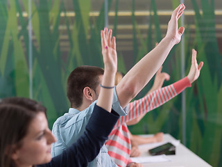 Image showing students group raise hands up on class