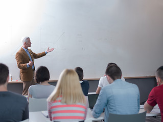 Image showing teacher with a group of students in classroom