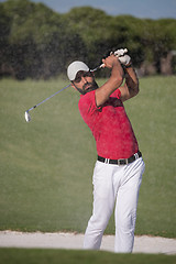 Image showing golfer hitting a sand bunker shot