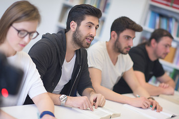 Image showing group of students study together in classroom