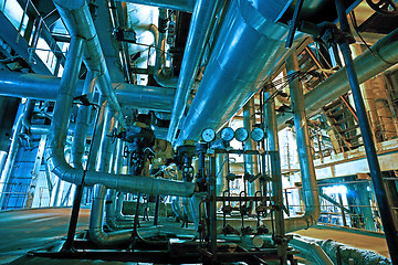 Image showing Equipment, cables and piping as found inside of a modern industr