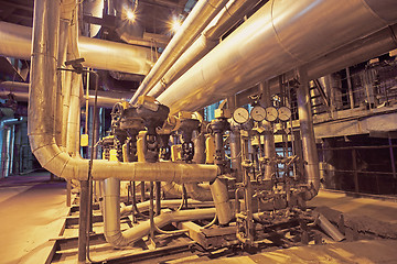 Image showing Equipment, cables and piping as found inside of a modern industr