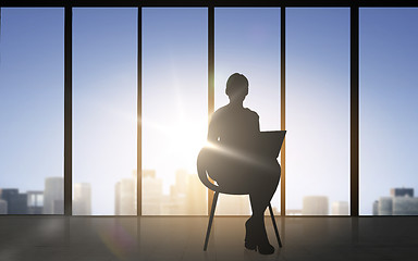 Image showing silhouette of business woman with laptop