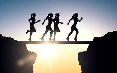 Image showing happy young sports woman running outdoors