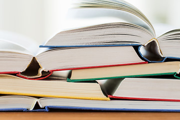 Image showing close up of books on wooden table