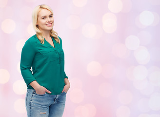 Image showing smiling young woman in shirt and jeans