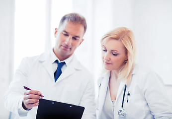 Image showing two doctors writing prescription