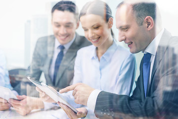 Image showing business team with tablet pc having discussion