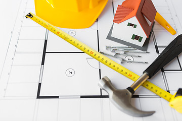 Image showing close up of house blueprint with building tools