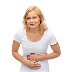 Image showing unhappy woman suffering from stomach ache