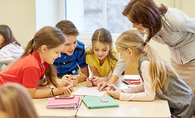 Image showing group of school kids writing test in classroom