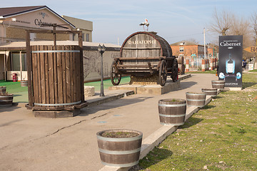 Image showing Sennoy, Russia - March 15, 2016: A view of a wine barrel and a wine press in firm shop \