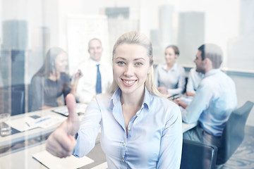 Image showing group of smiling businesspeople meeting in office