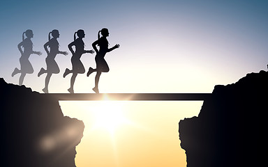 Image showing happy young sports woman running outdoors