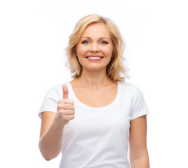 Image showing smiling woman in white t-shirt showing thumbs up