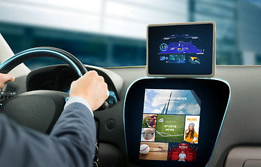 Image showing close up of man with gps on tablet pc driving car