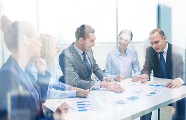 Image showing smiling business team at meeting