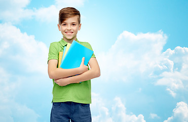 Image showing happy student boy with folders and notebooks