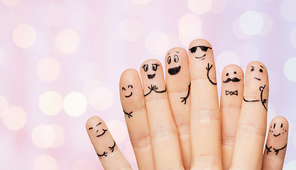 Image showing close up of hands and fingers with smiley faces