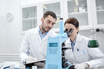 Image showing young scientists making test or research in lab