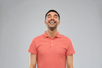 Image showing laughing man over gray background