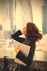 Image showing smiling woman with a laptop