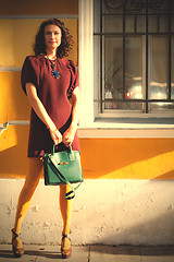 Image showing beautiful woman in a burgundy dress