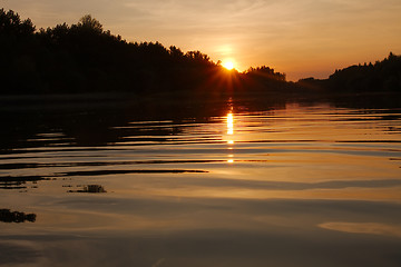 Image showing Sunset over a river