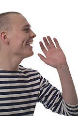 Image showing A bald man in striped vest