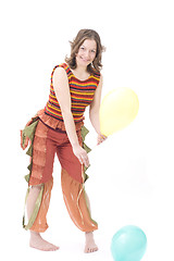Image showing Colorful dressed female with two balloons