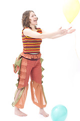 Image showing Colorful dressed female with two balloons II