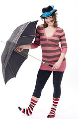 Image showing Colorful dressed female with umbrella