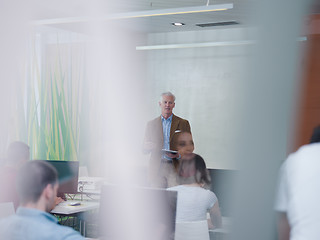 Image showing senior teacher and students group in computer lab classroom