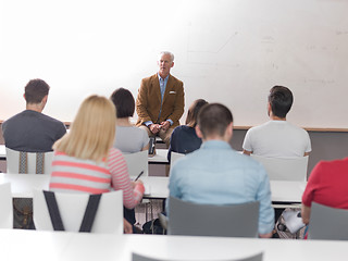 Image showing teacher with a group of students in classroom