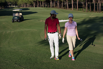 Image showing couple walking on golf course