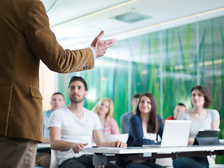 Image showing close up of teacher hand while teaching in classroom