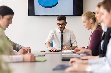 Image showing young business people group on team meeting at modern office