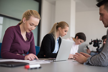 Image showing young business people group on team meeting at modern office