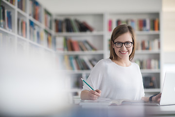 Image showing female student study in school library